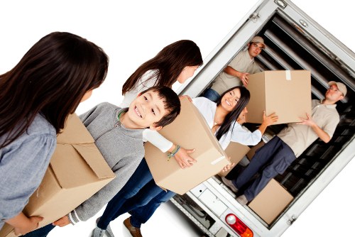 Man with van loading furniture for a Kingston home move