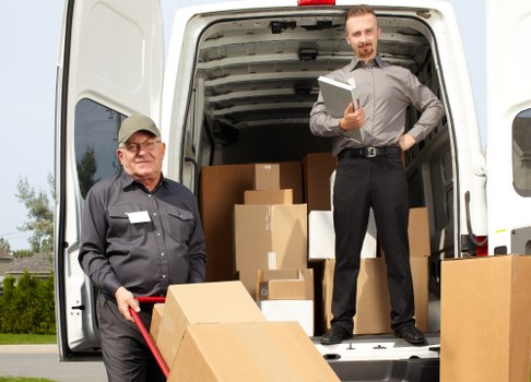 Removal team planning a Kingston home move with boxes and furniture