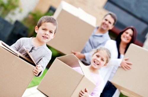 Packed moving boxes and furniture prepared for a Kingston home move