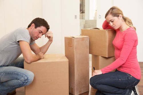 Packed boxes and furniture ready for loading into a moving van