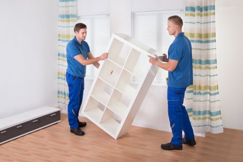 Local moving vehicle handling furniture and boxes in Kingston